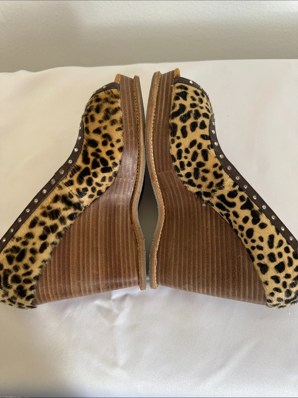 Animal print wedges with rhinestone trim. Leather upper size 8.